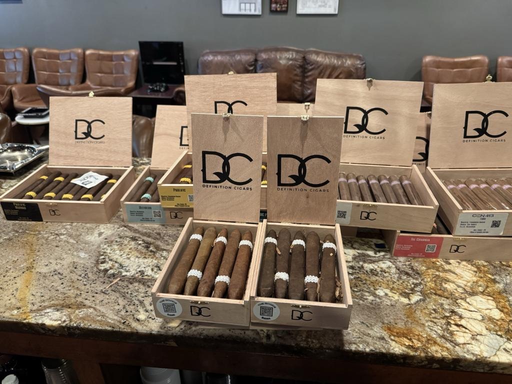 Definition Cigars DC branded boxes displayed on the counter at Downtown Cigar Company