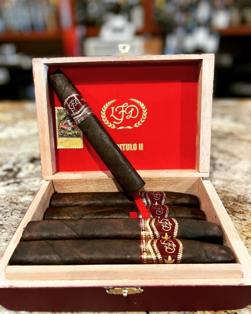 La Flor Dominicana premium cigar box with rich red interior and gold branding